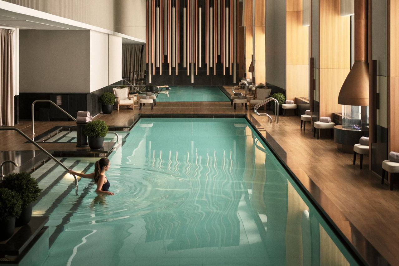 The heated indoor pool and fire pits at Aman Spa New York