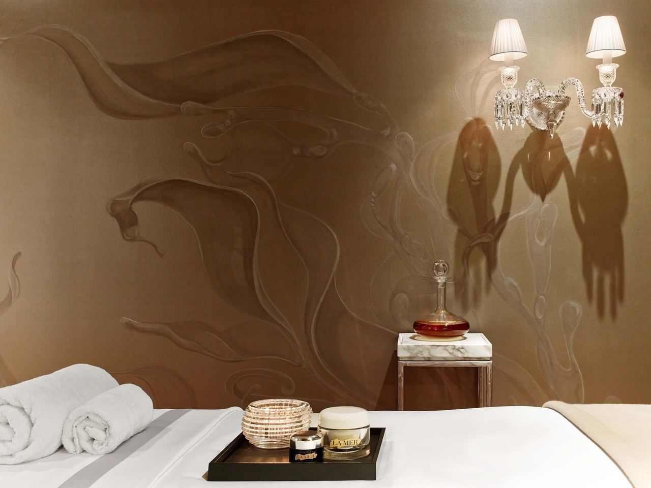 A treatment room with Baccarat crystal sconces at Spa de La Mer, Baccarat Hotel New York
