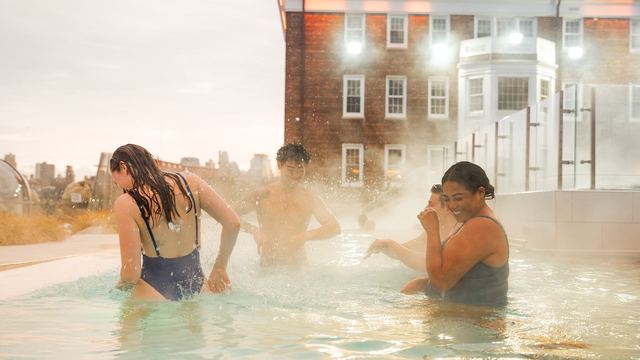 Bathers in a steaming outdoor pool at QC NY on Governors Island